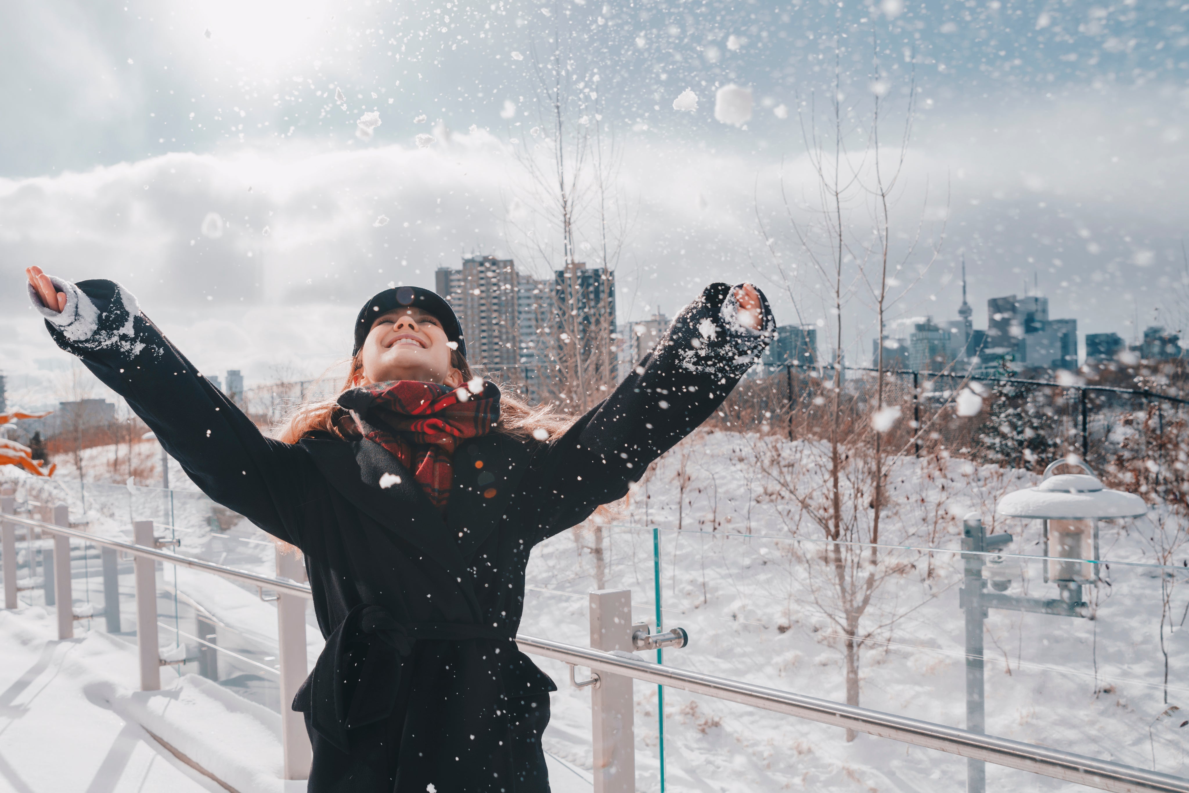 files/laughing-woman-in-snowy-urban-park.jpg